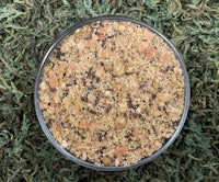 a bowl of granola on top of grass